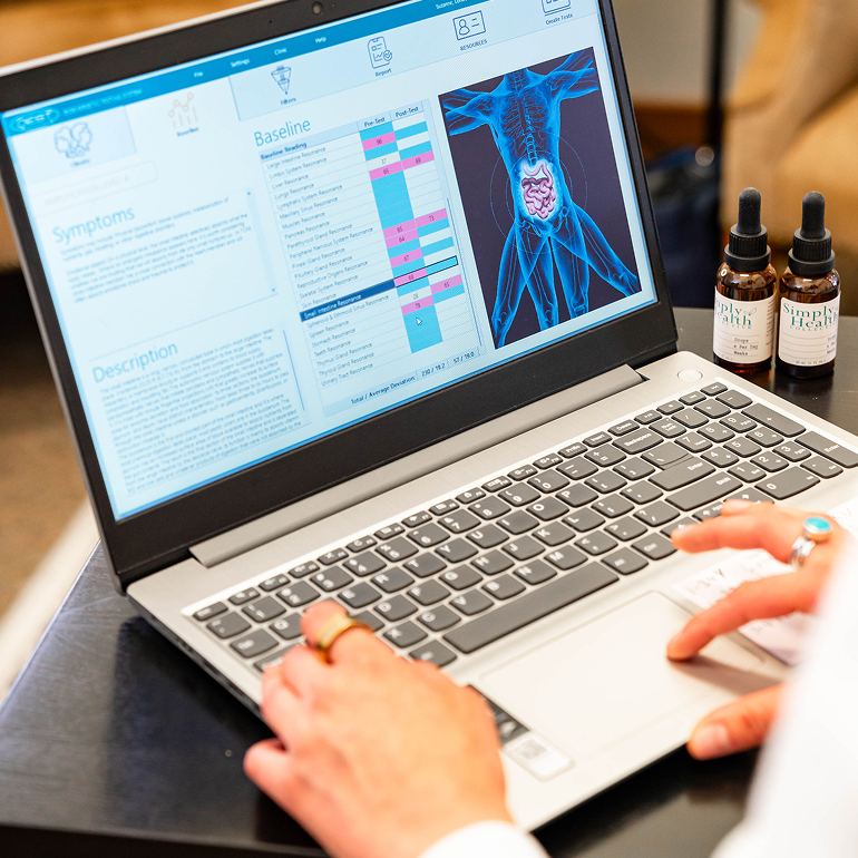 Person analyzing data on a medical imaging software on a laptop.