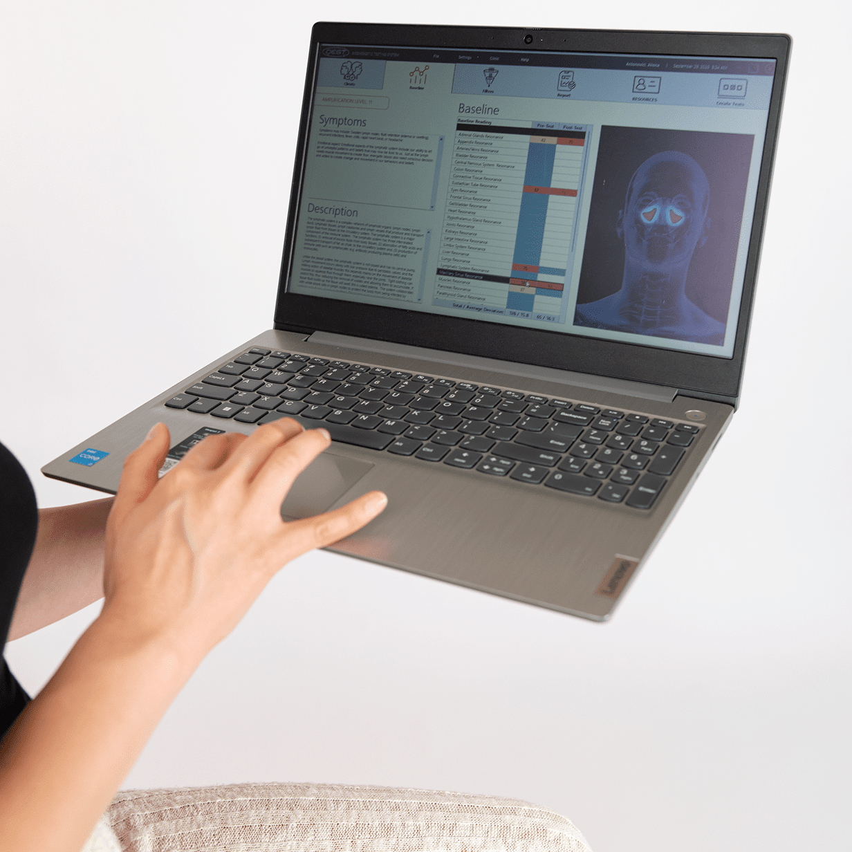 Person using face recognition on a laptop.